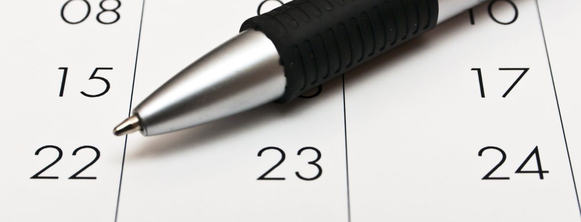Kalender und Kugelschreiber